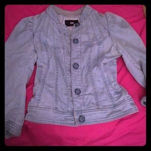 Denim peplum jacket with puffy shoulders.